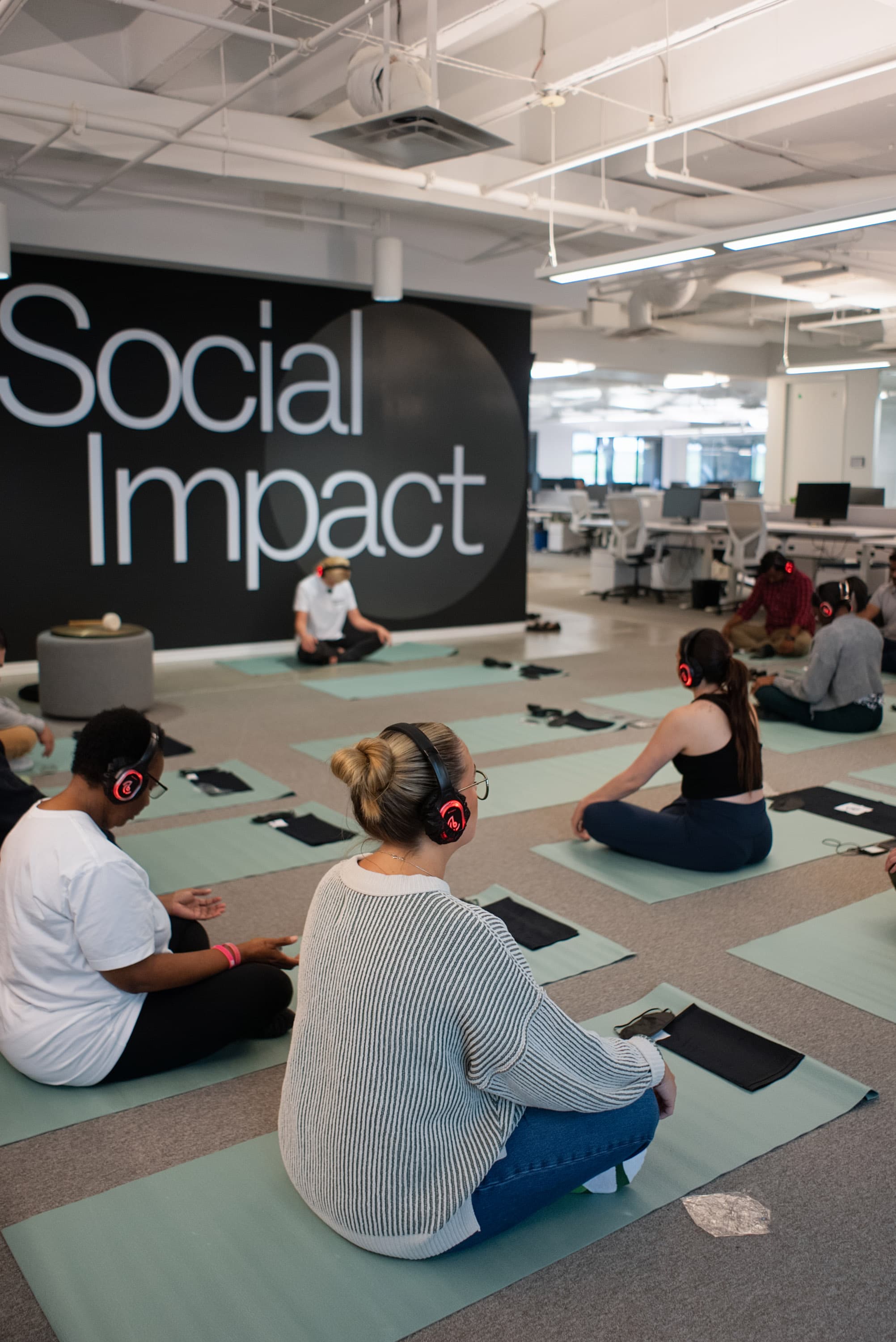 A team sharing a wellness-led team building activity in a Dallas office, Chakra Hours