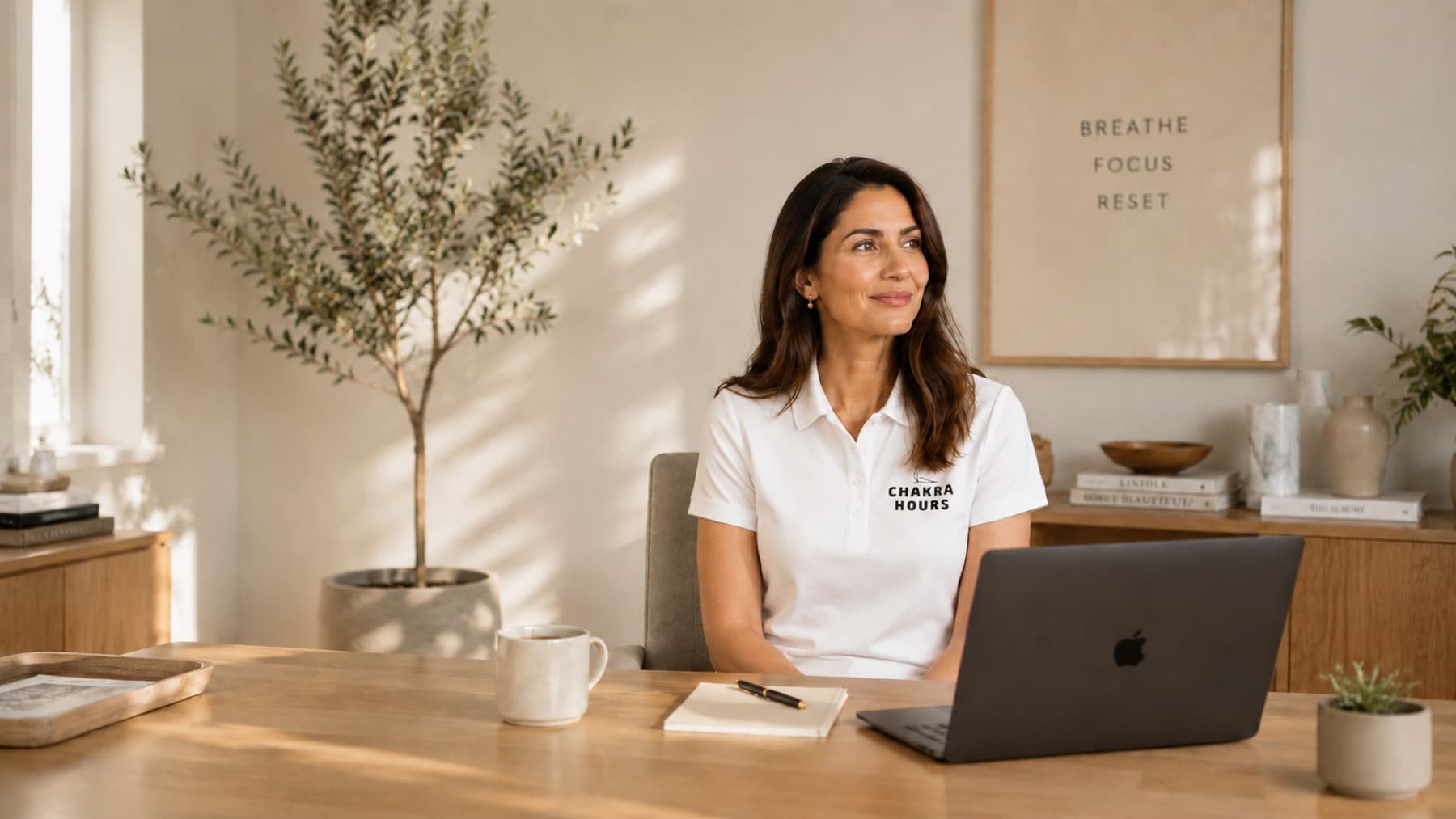 Chakra Hours wellness instructor at a desk preparing for a live virtual class pack session for HR teams