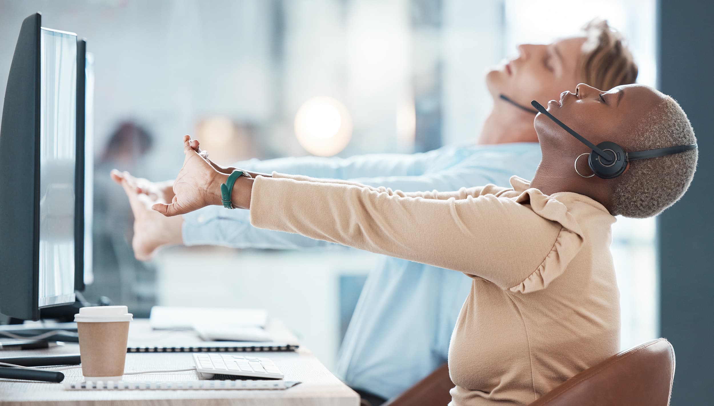Colleagues collaborating in a calm, stress-free modern office - manage stress at work guide - Chakra Hours