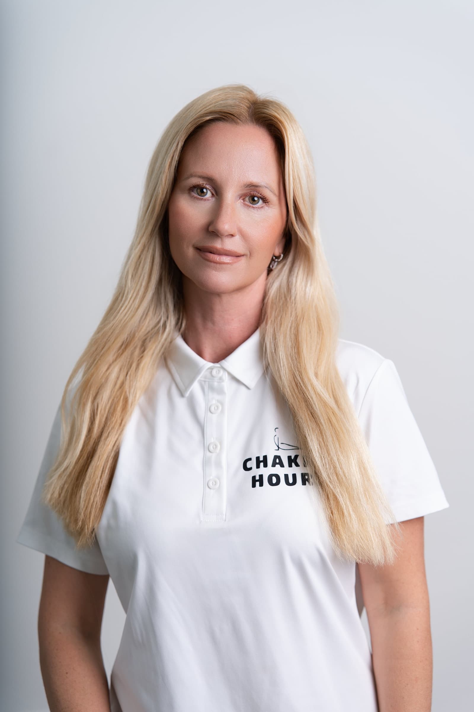 Nina Mua, founder of Chakra Hours, in the Chakra Hours polo, HR Wellbeing Planning Kit, Chakra Hours